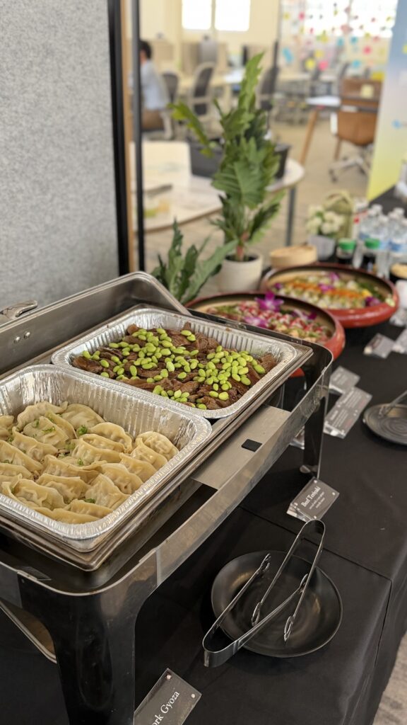 catering trays for corporate events with potstickers and teriyaki beef with edamame
